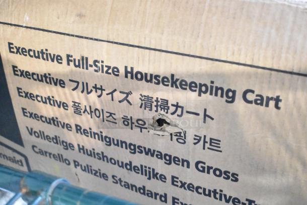 Brand new Rubbermaid® 2202527 full-size housekeeping cart box with visible scratch and dent. Text details cart specifications.