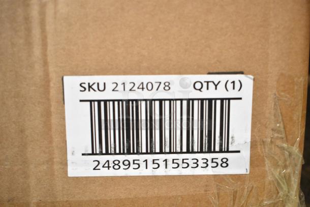 Cardboard box with barcode and label showing SKU 2124078, indicating a Rubbermaid Amenity Organizer for housekeeping carts.