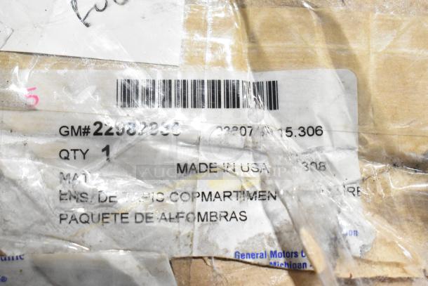 "New scratch and dent black anti-fatigue floor mat, GM# 22980230, made in USA, visible barcode and packaging details."