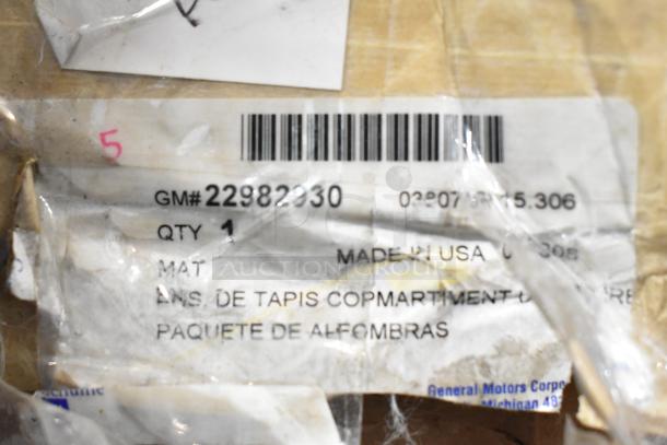 Barcode label on packaging for a black anti-fatigue floor mat, marked with "Made in USA" and GM#22982230. Slightly damaged.