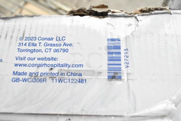 Conair iron packaging, showing Conair LLC address, website, and "Made and printed in China" label with product codes. Box edges are worn.
