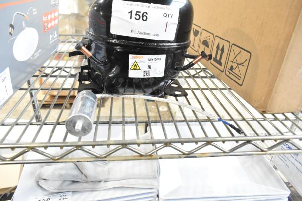 Cubigel NUY100NR Motor, 115-127V, 1 Phase, on a metal shelf, featuring a label with model and voltage details.