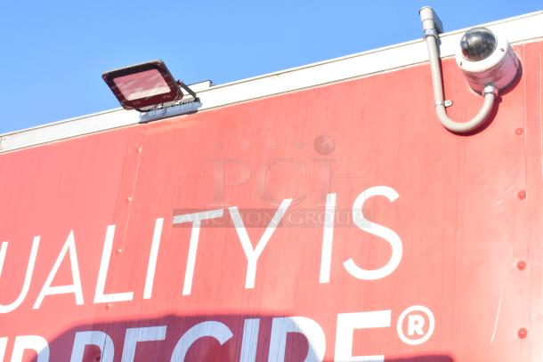 2021 Titanium Cargo 8.5' x 28' mobile kitchen trailer exterior showing surveillance camera and security light.