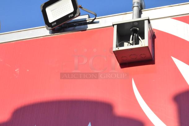 2021 Titanium Cargo mobile kitchen trailer, red exterior, featuring a 50W IP66 light fixture and visible wiring.