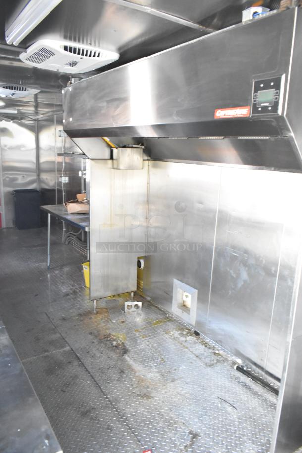 2021 Titanium Cargo 8.5' x 28' mobile kitchen trailer with CaptiveAire grease hood, 3-phase electric, plumbing, and Coleman Mach A/C.