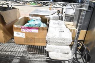 13 new scratch and dent items including Lavex 24 oz. #32 cotton mop heads with 5" headband, gloves. Box marked "2-20026".