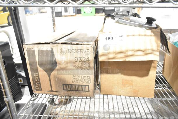 Box of Reserve 9324 Prism wine glasses, 1 dozen, 20 oz/591 ml, on shelf. Box shows wear. Includes topping dispensers.