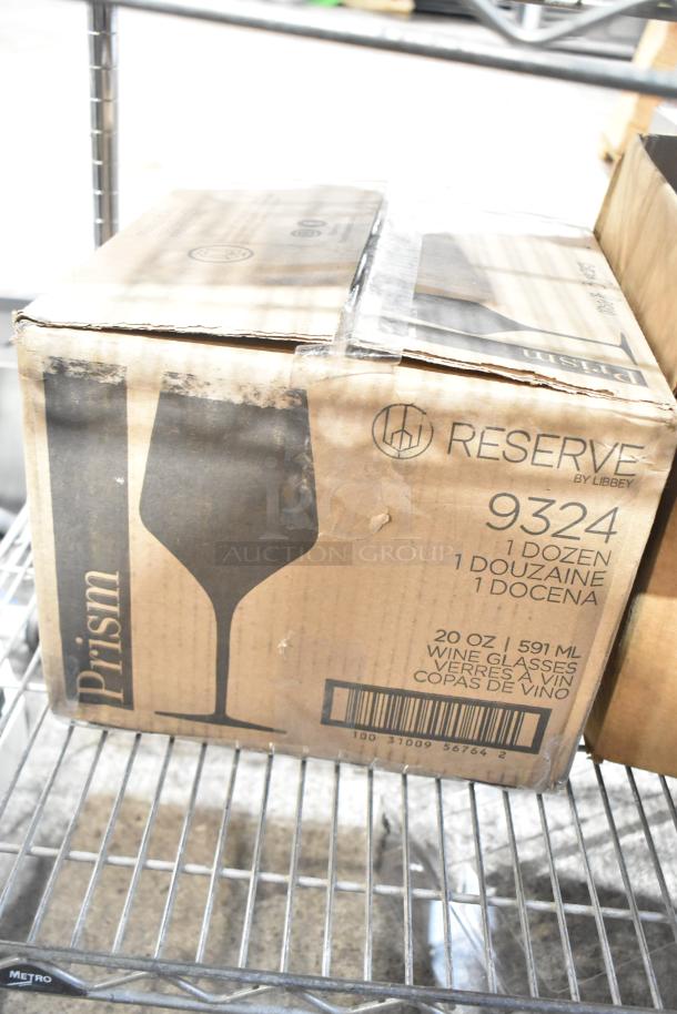 Box of Reserve by Libbey 9324 Prism Wine Glasses, 1 dozen, 20 oz, on metal shelf. Box is slightly worn.
