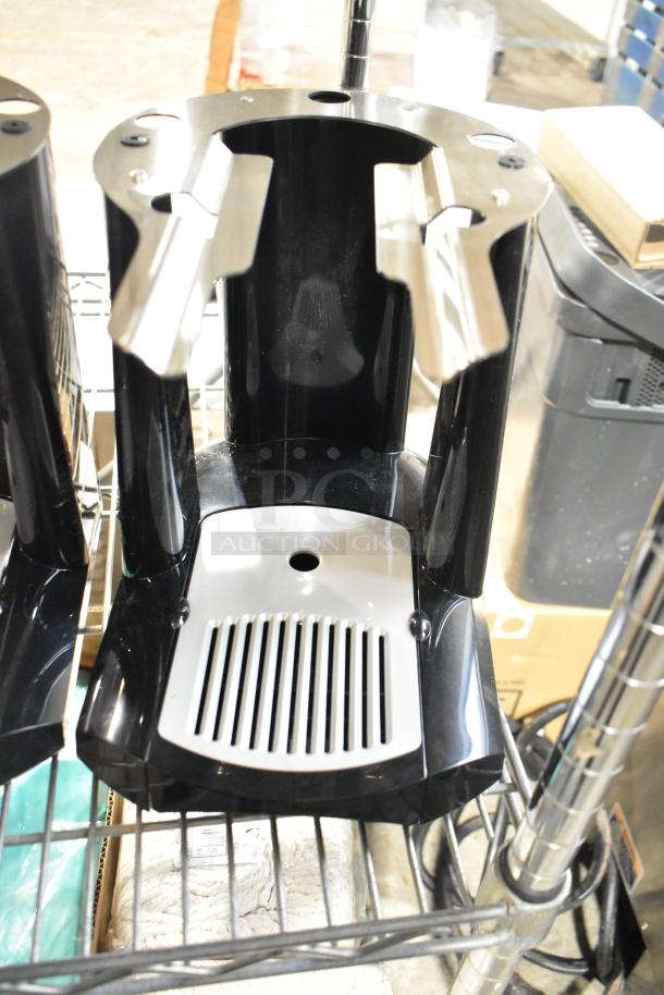 Black and silver beverage dispenser base, modern design, suitable for commercial use, appears in good condition.