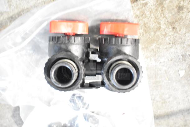 4 items including a double plastic fitting with red knobs. Includes Avantco start relay, V3007-04 fitting, and parts bag.