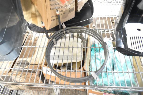 Various items including 17828028SC, Avantco 1782795S start relay, V3007-04 plastic fitting, and PRTB-CLACK-AS parts bag on shelf.