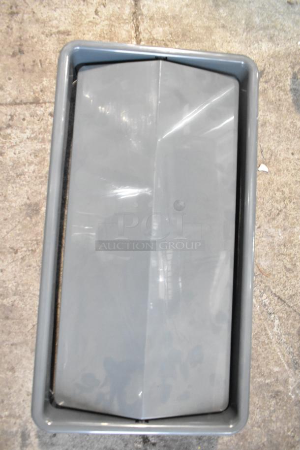 Gray Slim Jim Trash Can Lid, model 34202423, in good condition on concrete floor. Part of auction set.