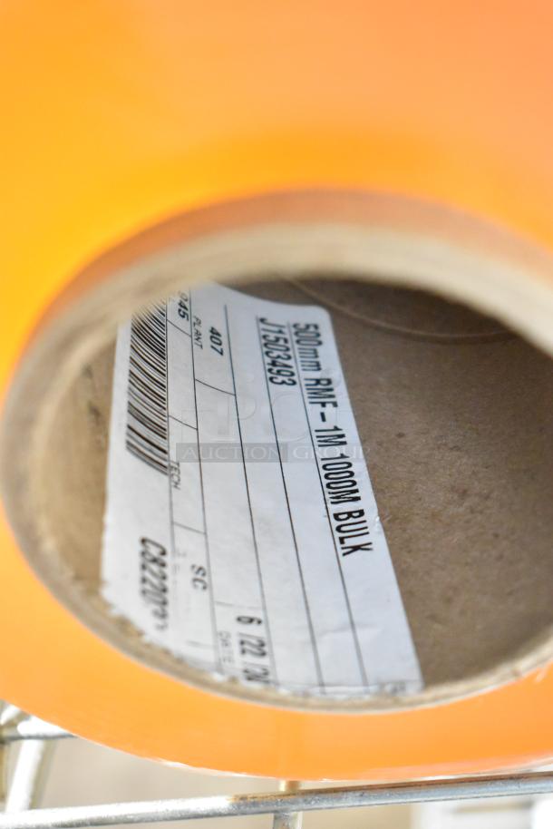 Roll of 500mm RMF-1M Plastic Wrap, orange, 1000m bulk. Visible label indicates product specifications and barcode.