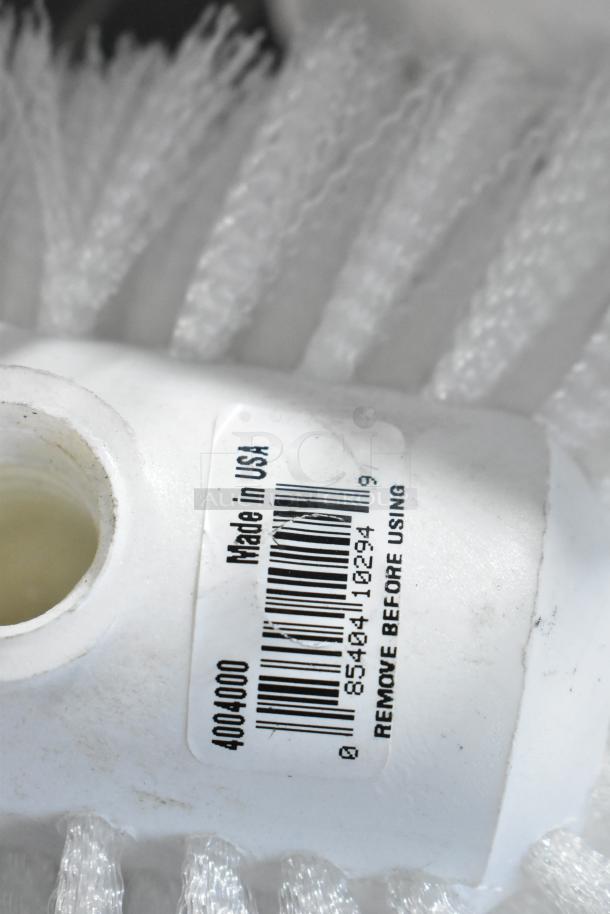 Toilet brush with white bristles and tag reading "Made in USA," barcode 85404102949, condition appears unused.