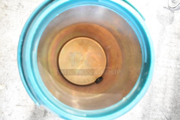 YM-1007 Beverage Dispenser interior view, teal exterior, stainless steel interior, showing minor wear.