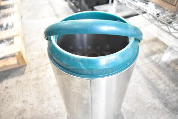 Stainless steel YM-1007 Beverage Dispenser with teal handle, showing slight wear. Ideal for event use.