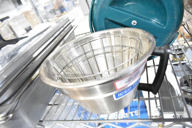 Stainless steel brew basket with label "Iced Tea" and black handle on metal shelf, part of varied auction lot.