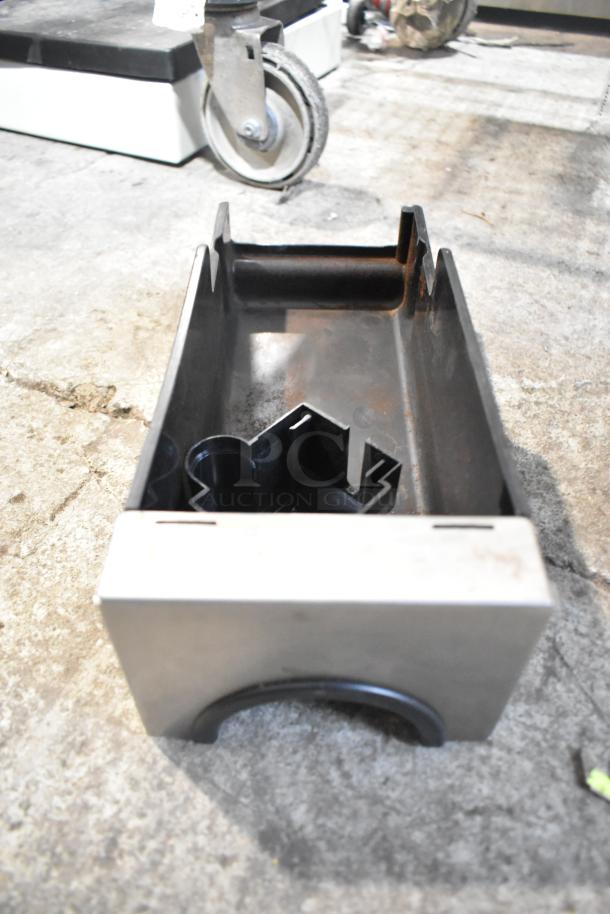 Stainless steel drop-in bin with visible wear, part of a lot with various items including a brew basket.
