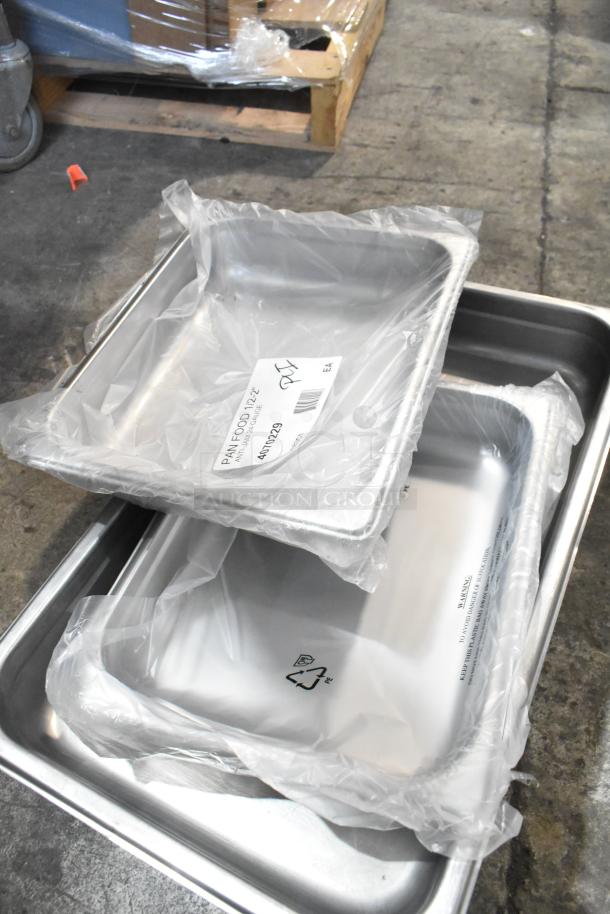 10 stainless steel drop-in bins, new with packaging, includes tag "Pan Food 12"" and recycling symbol.