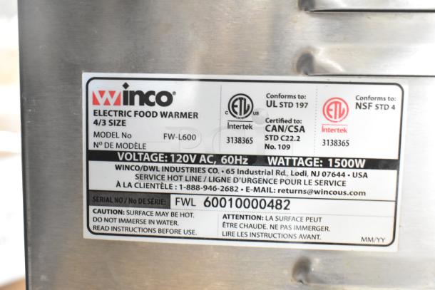 Winco FW-L600 Countertop Food Warmer, 120V, 1500W, 4/3 size. Features labels indicating voltage and safety certifications.