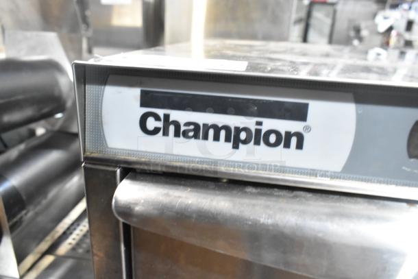 Champion UH130B commercial undercounter dishwasher. Features 120-208/230V, 1 Phase. Champion logo visible on the front panel.