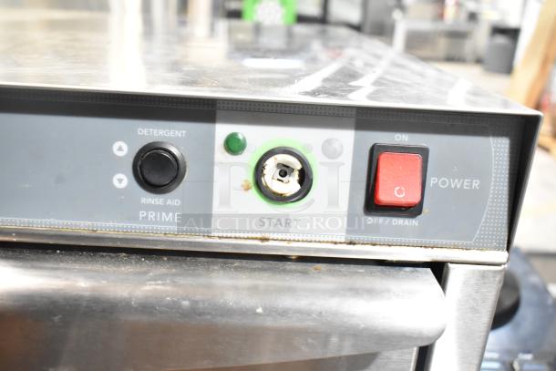 Champion UH130B commercial undercounter dishwasher with power and start buttons, in used condition. 120-208/230 V, 1 phase.