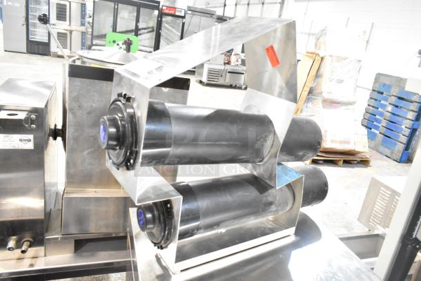 Eagle Holder with 2 San Jamar Cup Dispenser Chutes, metal frame, black chute finish, excellent condition, commercial use.