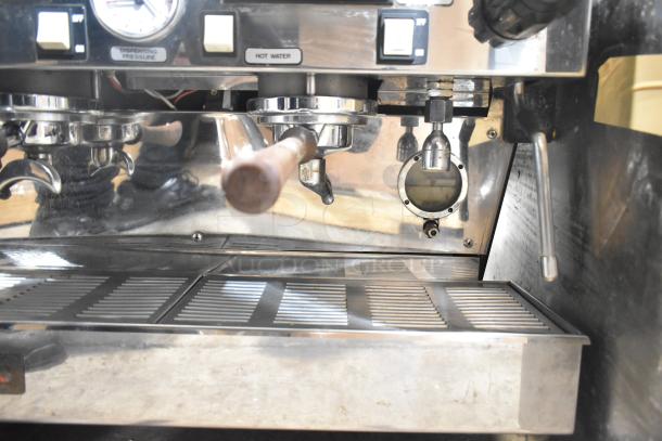 La Marzocco 2-group commercial espresso machine, includes dual portafilters, steam wands, pressure gauges.