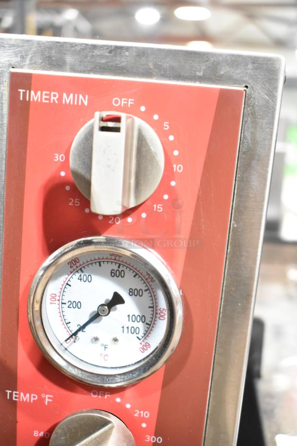 Avantco 177DPO18DD pizza oven timer and temperature dials, stainless steel finish, clear markings, good condition.