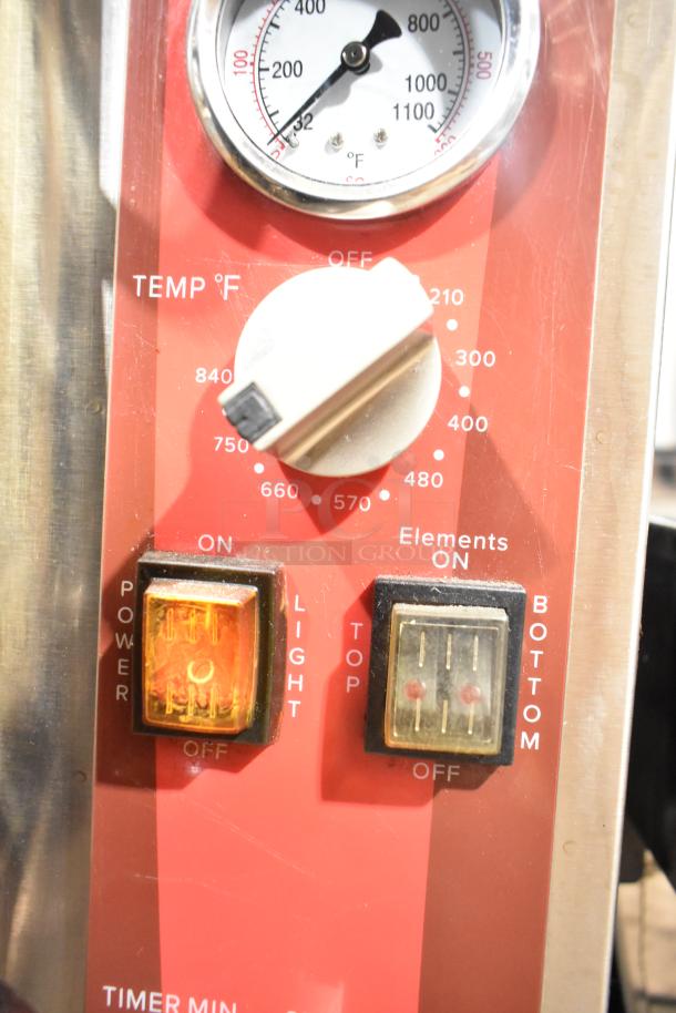 Avantco 177DPO18DD oven temperature control panel with dials for heat settings and switches for power and heating elements.