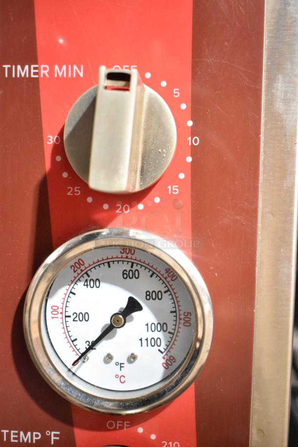 Avantco 177DPO18DD oven close-up showing temperature dial and timer on the red control panel.