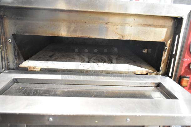 Avantco 177DPO18DD Double Deck Countertop Pizza/Bakery Oven with cooking stones. Features stainless steel body, signs of use visible.