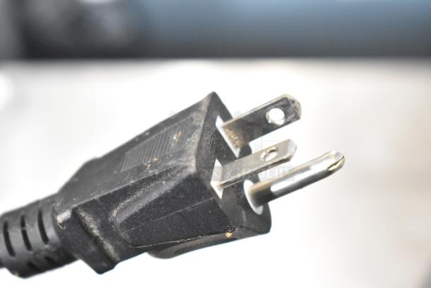 Black power plug of Avantco 177DPO18DD oven. 240 Volts, 1 Phase, close-up detail. Condition: slightly worn.