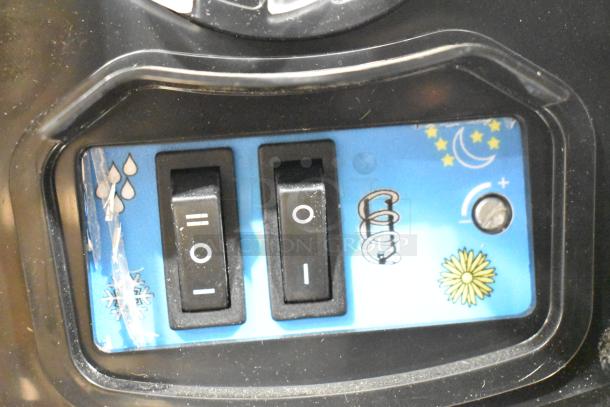 2023 Carnival King 382SMM1 Aurora 1 Granita Machine controls, featuring dual switches and indicator icons.