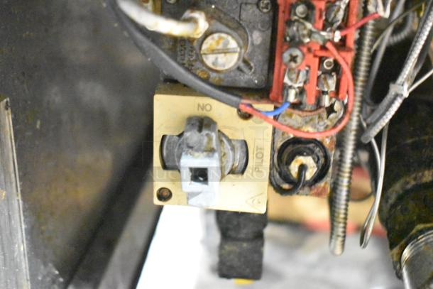 Pitco Frialator SG14-S control area, with visible wiring and pilot switch, shows signs of use, commercial-grade.