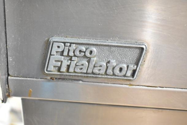 Pitco Frialator SG14-S commercial fryer logo on stainless steel. Model SG14-S, 110,000 BTU, visible wear.