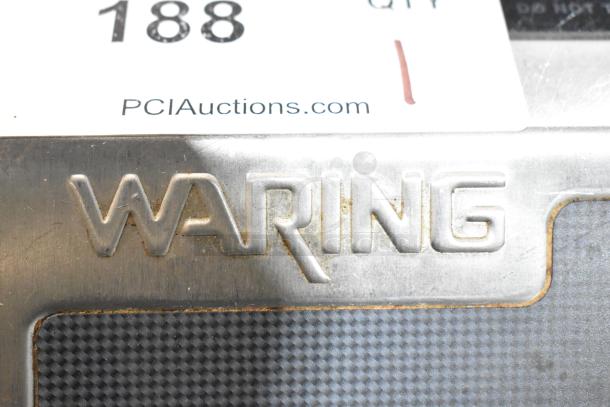 Waring WIH400 Single Burner Induction Range, visible branding, in used condition. 120 Volts, 1 Phase. Auction label shown.