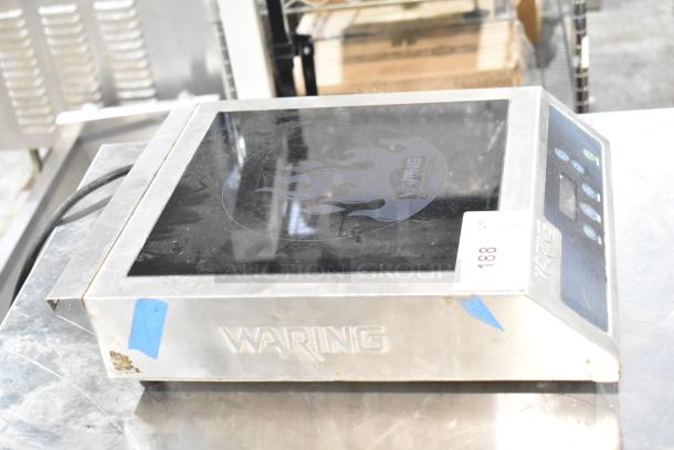 Waring WIH400 Induction Range, 120 Volts, 1 Phase, visible brand logo, stainless steel exterior, countertop model.