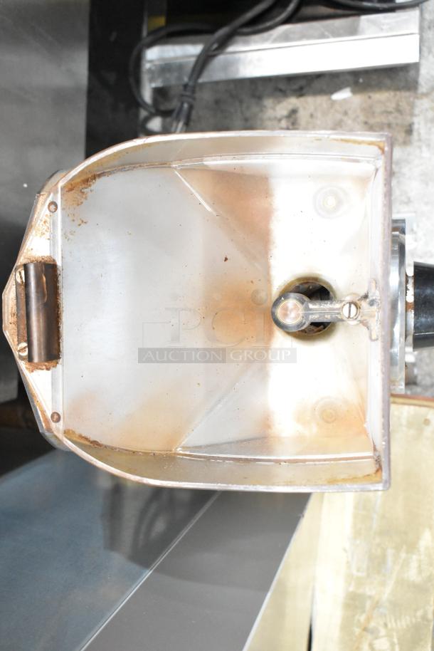 Mahlkonig K32S10 commercial coffee grinder with visible wear. Hopper top view, 115 volts, 1 phase. Countertop model.