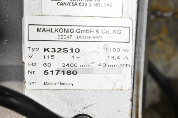 Mahlkonig K32S10 commercial coffee grinder label, 115V, 1-phase, 1100W, 13.4A, made in Germany, model details visible.