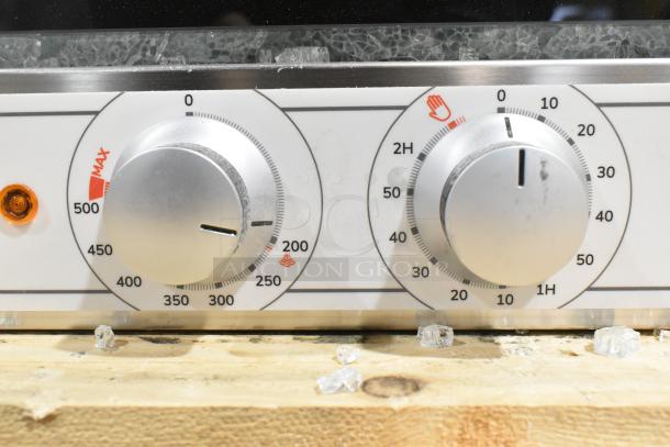 Cooking Performance Group 351COFT4M convection oven controls with clear broken glass shards visible on the surface.