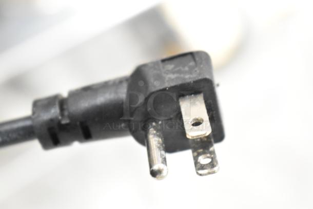 Close-up of a three-prong power plug for a KoolMore KM-RPPS-SCDC-59 refrigerated rail, 115V, 1 phase.