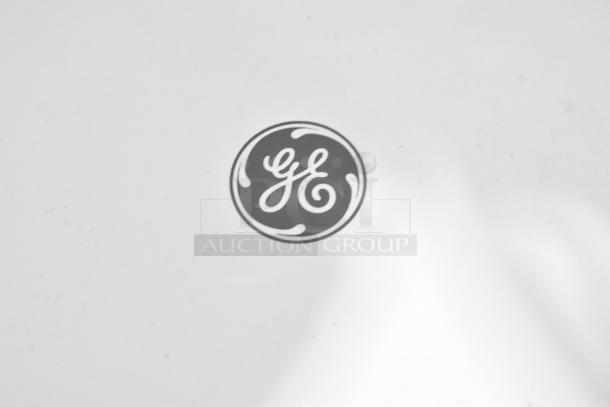 2018 GE ADEL30LWQ1 dehumidifier logo. 115 volts, 1 phase. White surface, visible GE emblem.