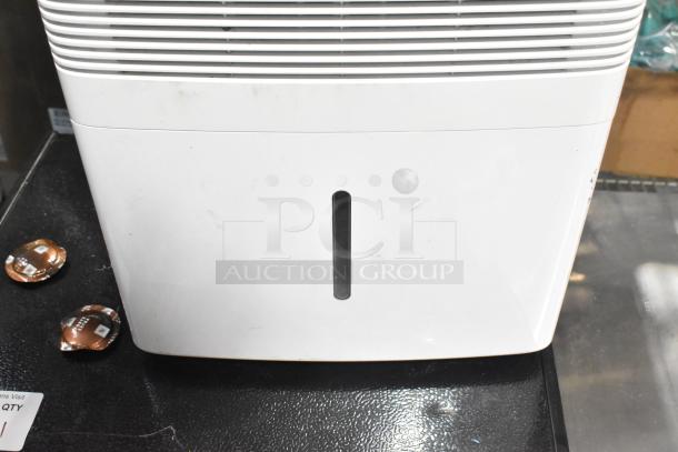 2018 GE ADEL30LWQ1 Dehumidifier, 115V, 1 Phase. Minor surface marks, front view. Visible water level indicator.