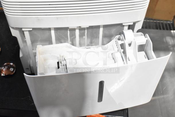 2018 GE ADEL30LWQ1 dehumidifier, 115V, seen with open water tank. White unit with visible wear and dirt marks.