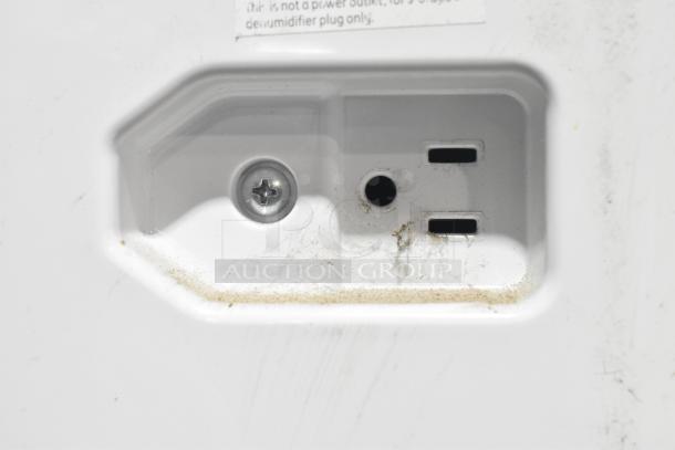 2018 GE ADEL30LWQ1 dehumidifier outlet close-up. Shows plug area with signs of wear. 115 volts, 1 phase.