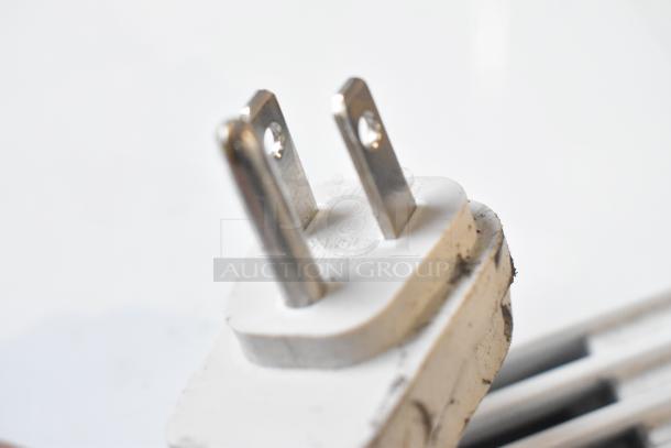 Close-up of a 2018 GE ADEL30LWQ1 dehumidifier plug, 115 volts, showing slight wear.