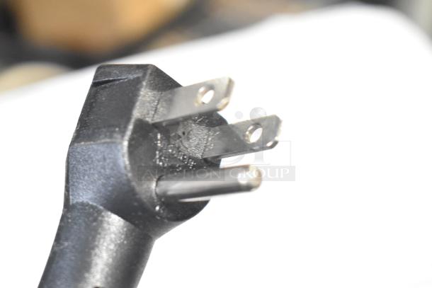 Power plug of Electactic BD-50 Chest Freezer, 115 Volts, 1 Phase model, showing three-prong design, close-up view.