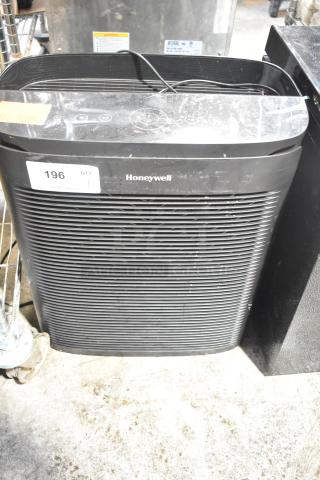 Honeywell HPA3300B Air Purifier, black, with visible control panel. Label indicates 120V, 1 Phase. Slight surface wear.