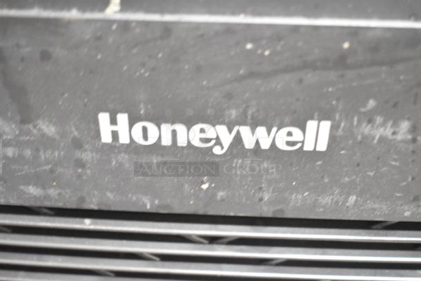 Honeywell HPA3300B air purifier, 120 volts, 1 phase. Dust on surface, visible Honeywell logo, model for larger spaces.